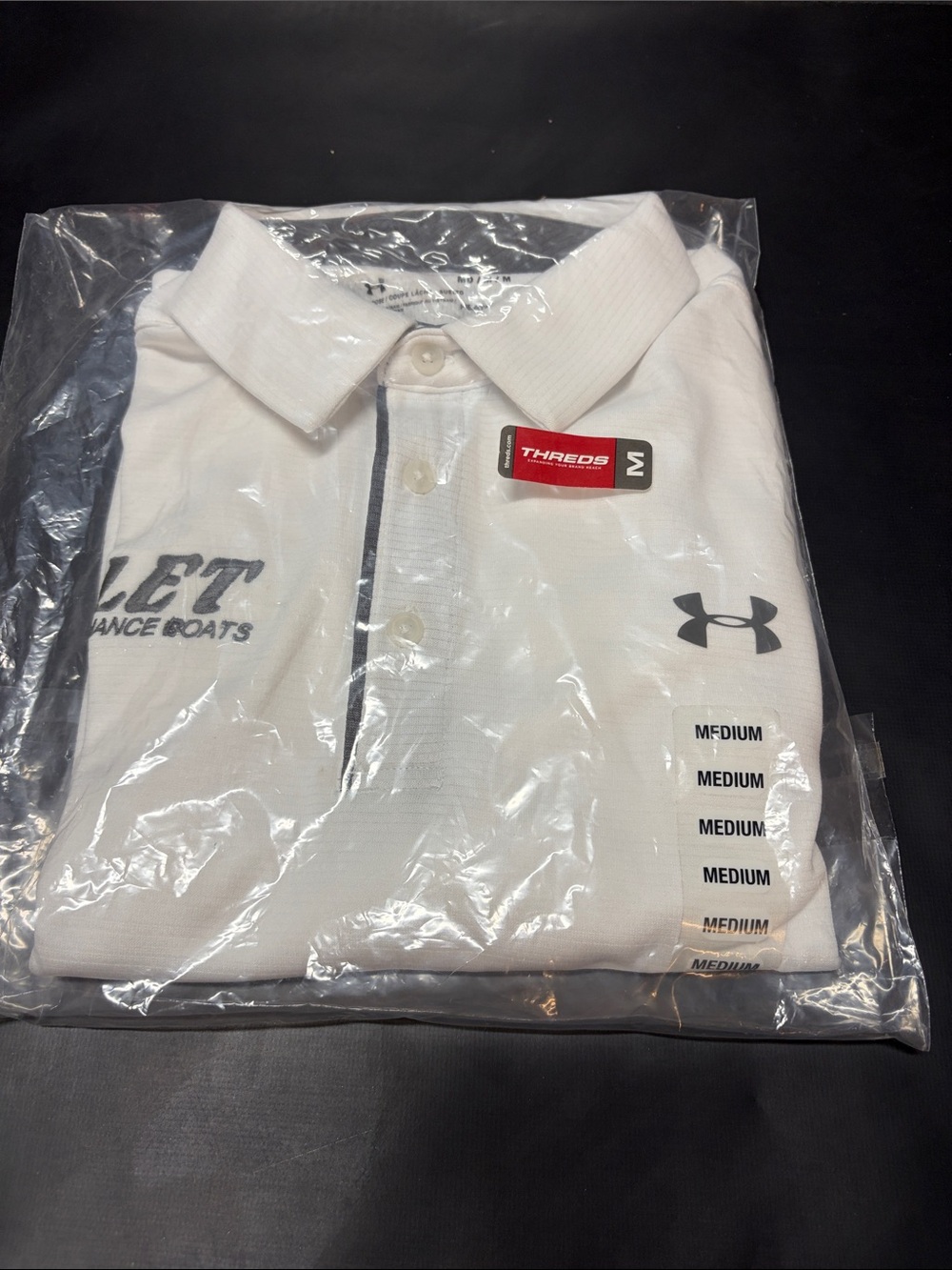 Under Armour Men’s White Polo with Black Logo Accent (Bullet Performance Boats)